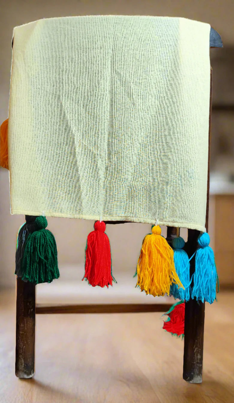 Lemon yellow chair cover with colourful tassel