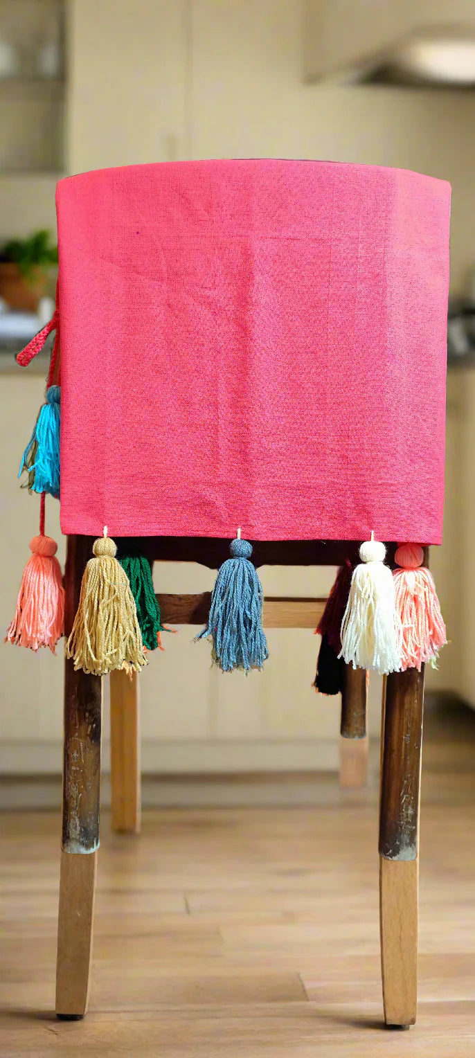 Pink chair cover with colourful tassel