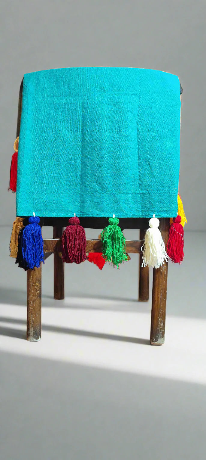Emerald green chair cover with colourful tassel