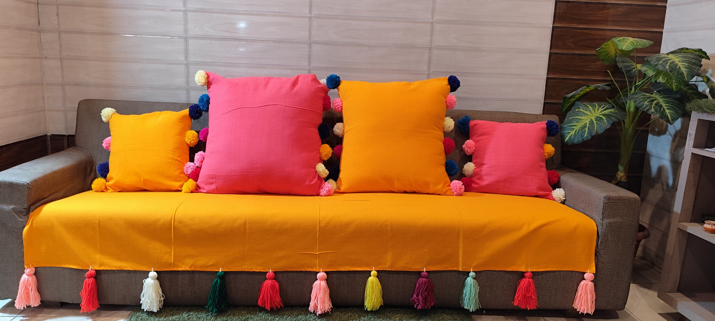 Mustard yellow sofa cover with jumbo rainbow tassel