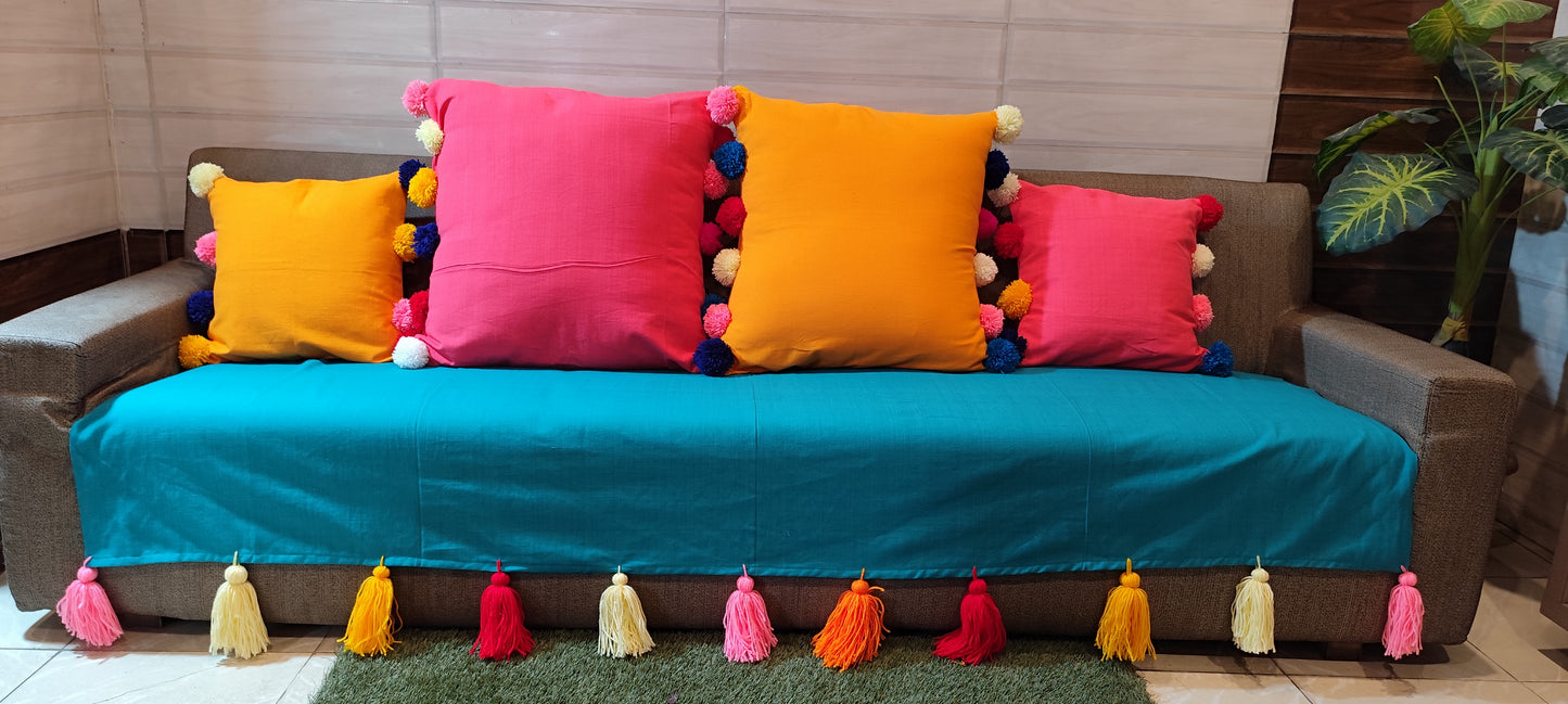 Turquoise anti slip sofa cover with jumbo rainbow tassels