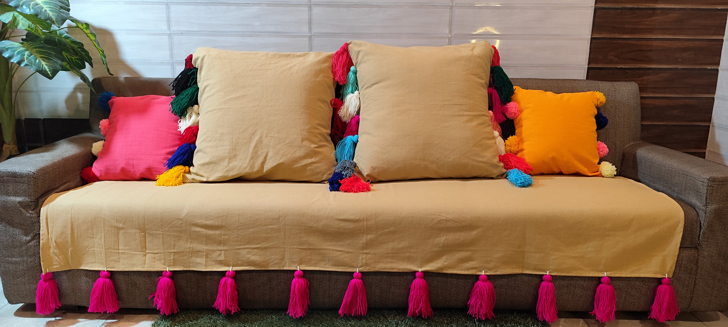 Dark beige sofa cover with mergentta jumbo tassels