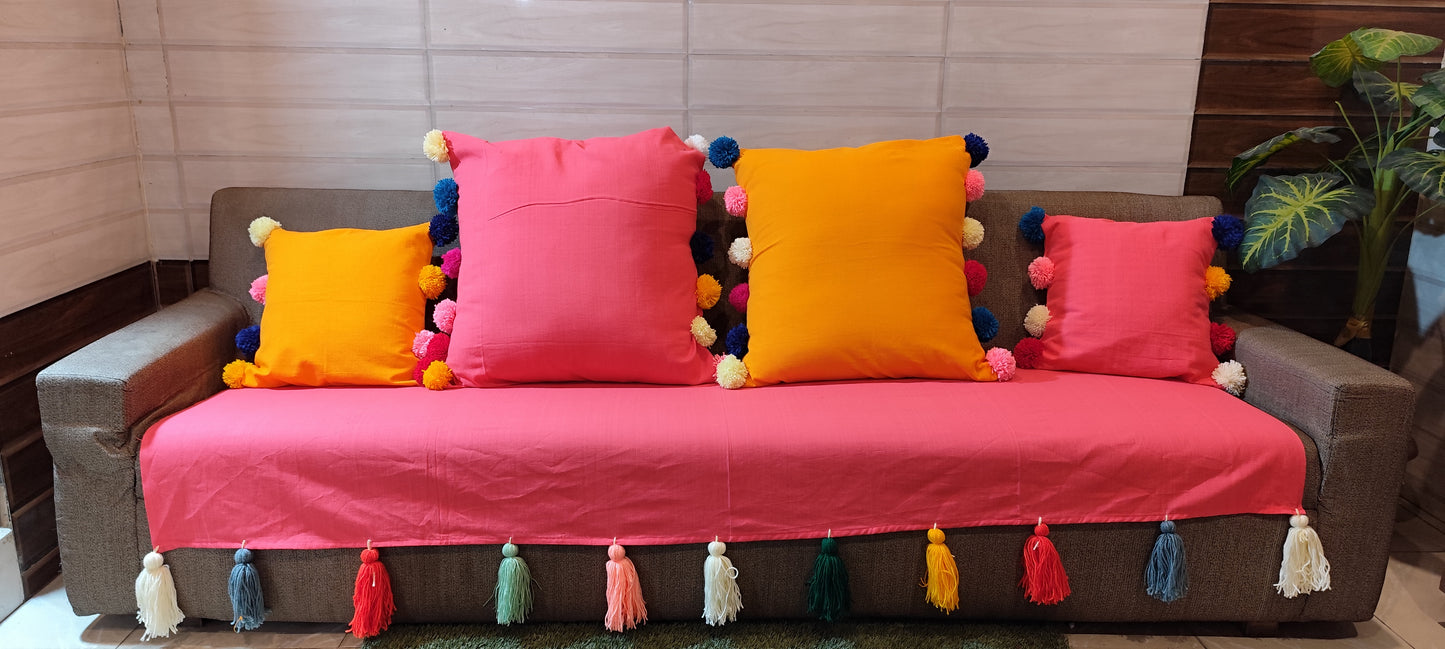 Carrot pink sofa cover with jumbo rainbow tassels