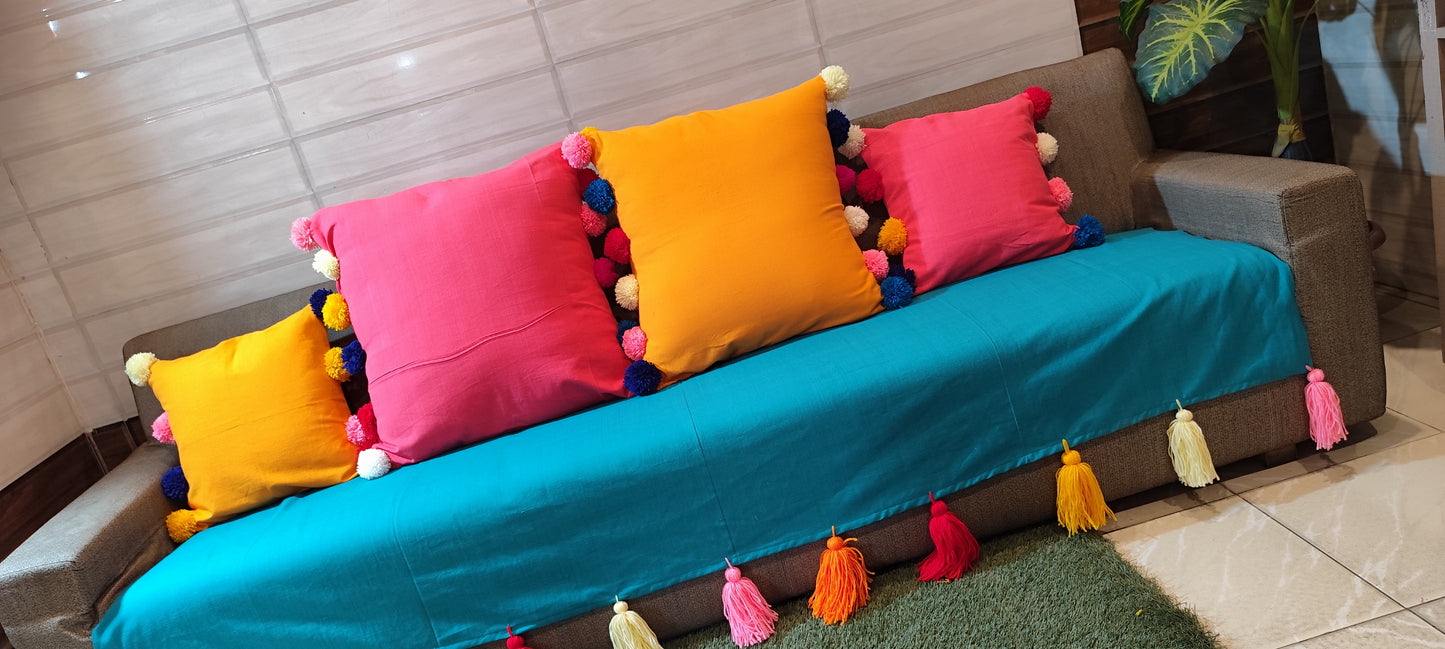 Turquoise anti slip sofa cover with jumbo rainbow tassels