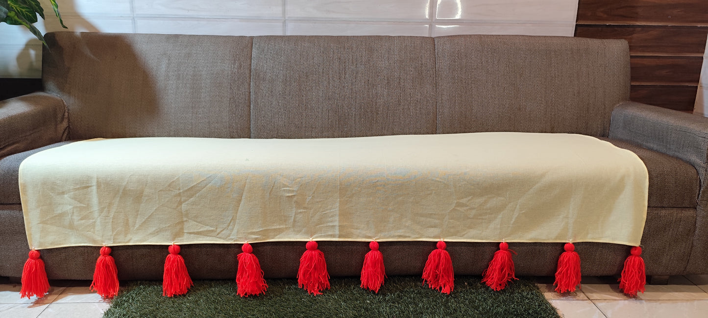Lemon yellow sofa throw with red jumbo tassels