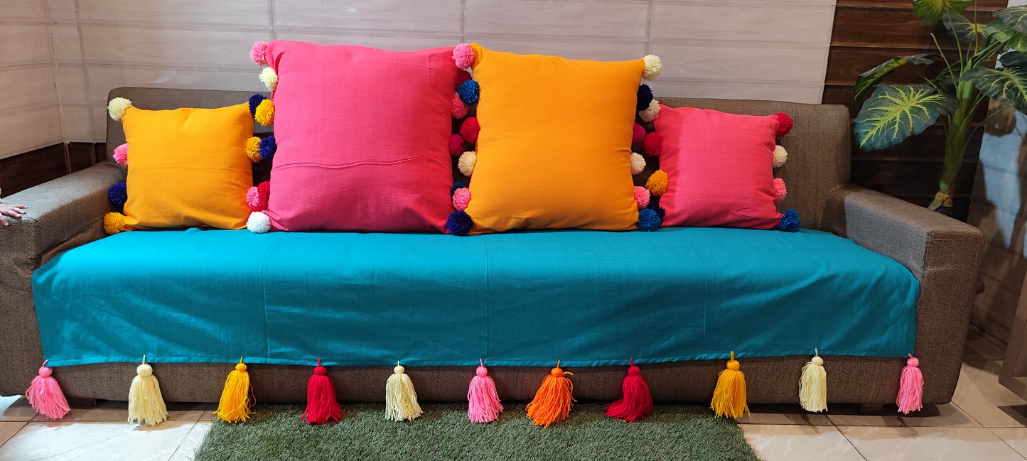 Turquoise anti slip sofa cover with jumbo rainbow tassels