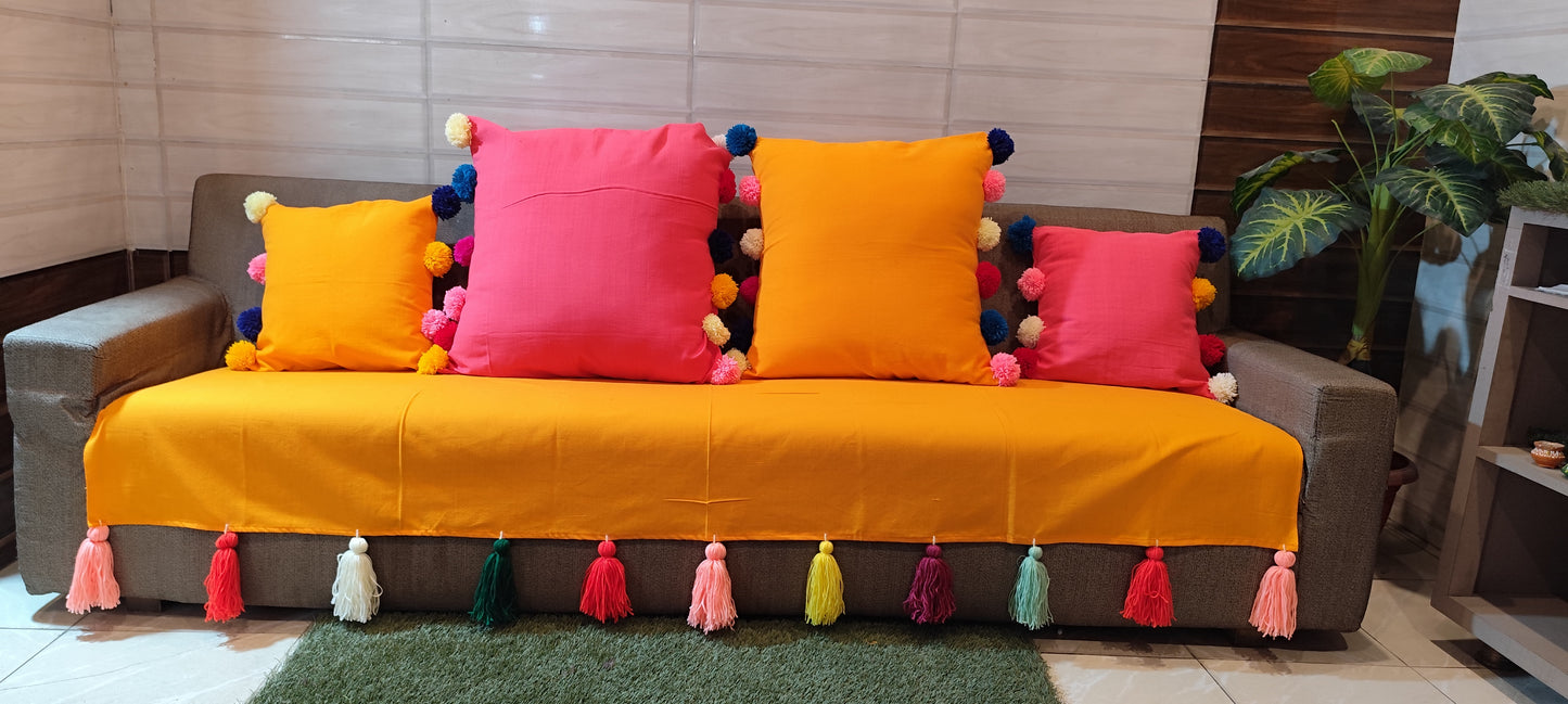 Mustard yellow sofa cover with jumbo rainbow tassel
