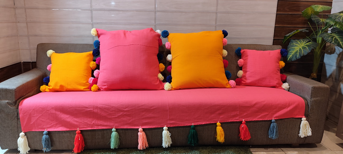 Carrot pink sofa cover with jumbo rainbow tassels