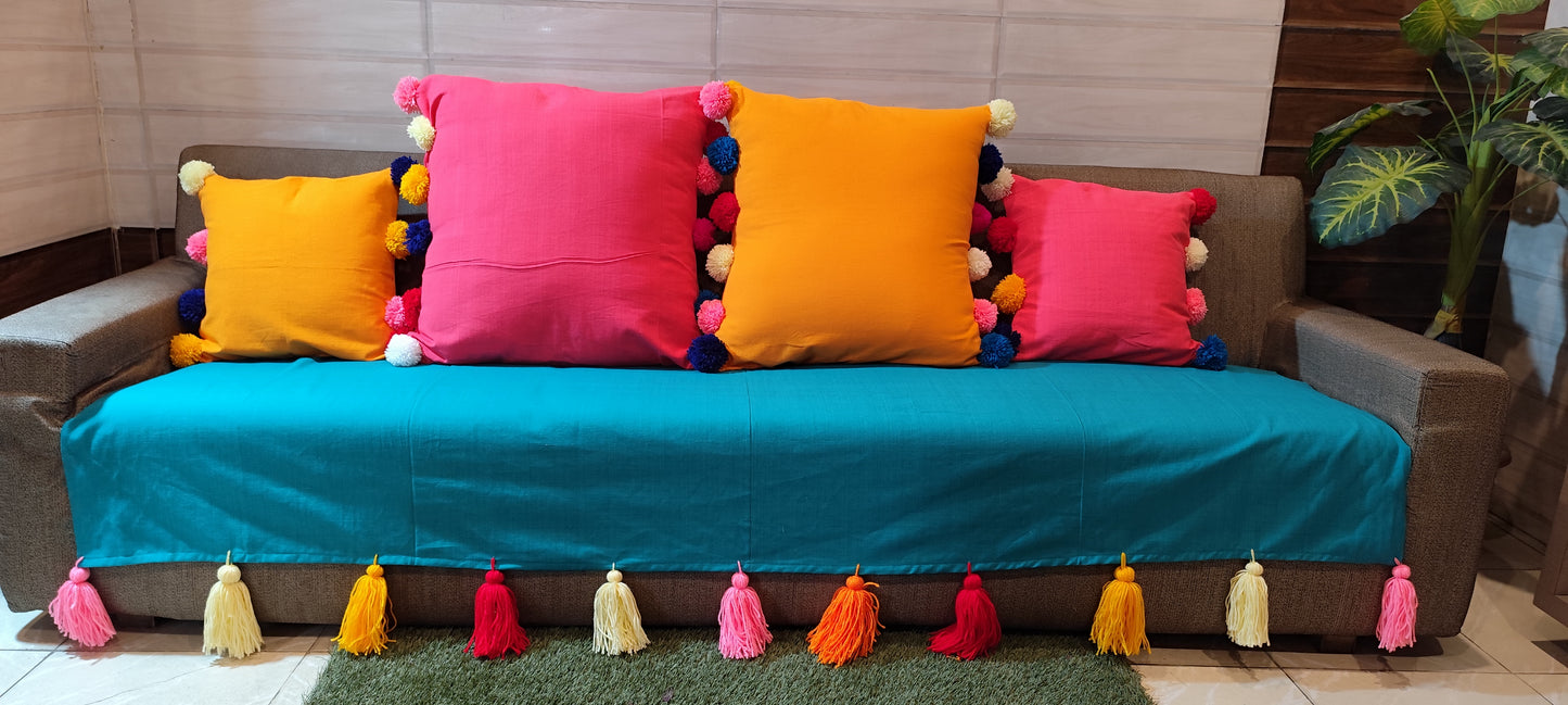 Turquoise anti slip sofa cover with jumbo rainbow tassels