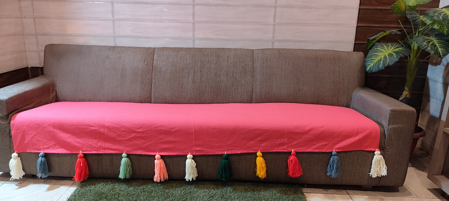 Carrot pink sofa cover with jumbo rainbow tassels