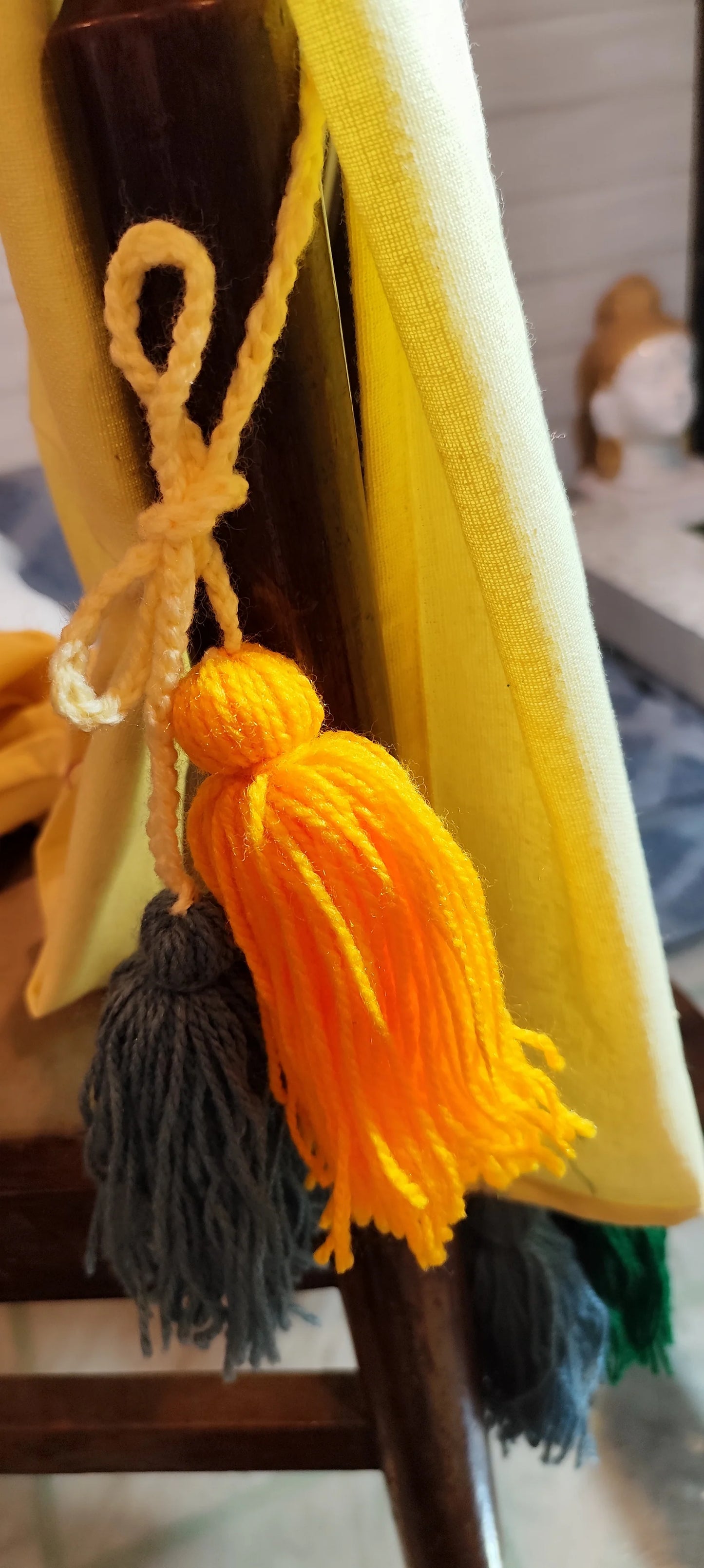 Lemon yellow chair cover with colourful tassel